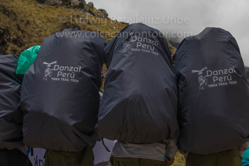 Porters with heavy bagpacks
